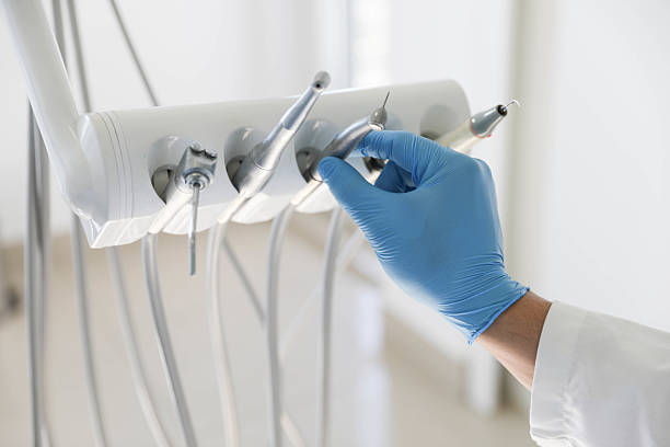 Professional Tooth Extraction technician working in Collins, MS